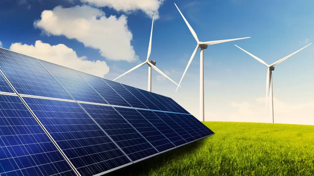 Painéis solares e turbinas eólicas em um campo